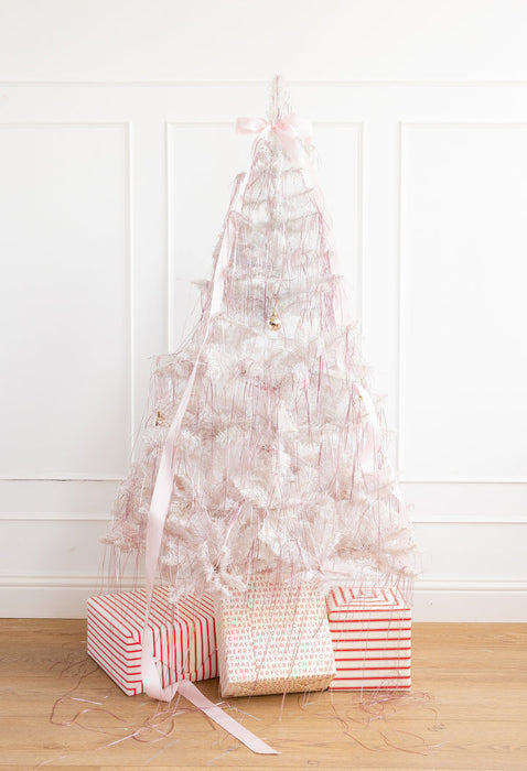 Christmas Pink Tinsel hanging on a Christmas tree.