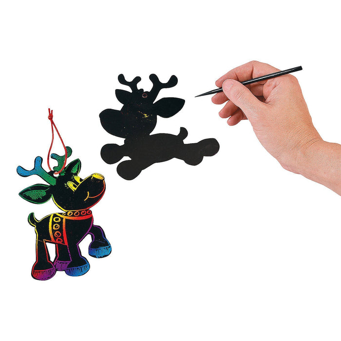 a person making the  Cool2Create Magic Color Scratch Reindeer Ornaments.